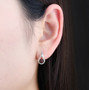 dancing garnet and white zircon dangle earrings in rhodium over sterling silver