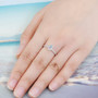 oval ethiopian opal and white zircon halo ring in rhodium over sterling silver worn on a hand