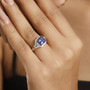 tanzanite paraiba tourmaline and diamond ring in 950 platinum worn on a hand