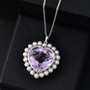 rose de france amethyst heart and freshwater pearl halo pendant necklace in rhodium over sterling silver shown in a lifestyle photo