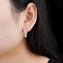 ethiopian opal hoop earrings in rhodium over sterling silver worn on the ear