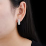ethiopian opal and white zircon hoop earrings in rhodium over sterling silver worn on the ear