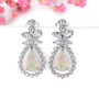 ethiopian opal and white zircon earrings in rhodium over sterling silver shown in a lifestyle photo