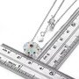 ethiopian opal and garnet cluster necklace in rhodium over sterling silver shown for size comparison