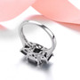 back view of black spinel trilogy ring with white zircon accents in rhodium over sterling silver