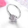 back view of ruby and white zircon halo ring in rhodium over sterling silver