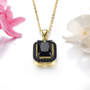 side view of emerald cut black spinel halo pendant necklace in 18k yellow gold and black rhodium over sterling silver
