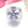 front view of tanzanite and white zircon flower ring in rhodium over sterling silver