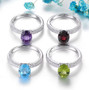 full view of swiss blue topaz and white zircon solitaire ring in rhodium over sterling silver