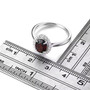 garnet and white zircon halo ring in rhodium over sterling silver shown for size comparison