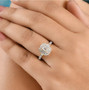 emerald cut halo lab diamond ring in 18k yellow gold over sterling silver worn on a hand