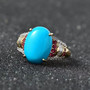 sleeping beauty turquoise rubellite and diamond ring in solid 10k yellow gold shown in a lifestyle photo