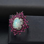 opal rhodolite garnet and zircon statement ring in rhodium over sterling silver shown in a lifestyle photo