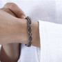 chocolate sapphire tennis bracelet in rhodium over sterling silver worn on a wrist