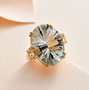 prasiolite and white topaz cocktail ring in 18k yellow gold over sterling silver shown in a lifestyle photo