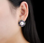 freshwater pearl and multi gemstone post and omega back earrings in rhodium over sterling silver worn on the ear