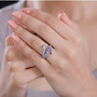 tanzanite white zircon and black spinel snake ring in rhodium over sterling silver worn on a hand