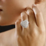lab grown diamond heart ring in rhodium over sterling silver worn on a hand