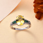 heliodor emerald and white zircon ring in rhodium over sterling silver shown in a lifestyle photo