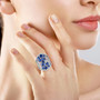 kyanite tanzanite and moissanite statement ring in rhodium over sterling silver worn on a hand