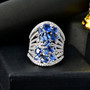 kyanite tanzanite and moissanite statement ring in rhodium over sterling silver shown in a lifestyle photo