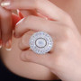 rainbow moonstone and moissanite statement ring in rhodium over sterling silver worn on a hand