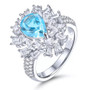 full view of swiss or sky blue topaz and white zircon halo cluster ring in rhodium over sterling silver