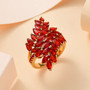 fire opal bypass ring in 18k yellow gold over sterling silver shown in a lifestyle photo