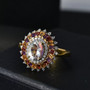 rainbow moonstone and multi gemstone halo ring in 18k yellow gold over sterling silver shown in a lifestyle photo