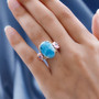 larimar shell and blue apatite flower ring in two-tone 18k yellow gold and rhodium over sterling silver worn on a hand