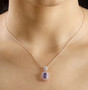 tanzanite pink sapphire and diamond pendant necklace in 18k rose gold over sterling silver worn around the neck