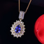 tanzanite yellow sapphire and diamond pendant necklace in 18k yellow gold over sterling silver shown in a lifestyle photo