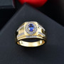 tanzanite and zircon gents ring in 18k yellow gold over sterling silver shown in a lifestyle photo