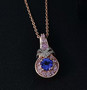 tanzanite pink sapphire and zircon pendant necklace in 18k rose gold over sterling silver shown in a lifestyle photo