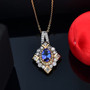 tanzanite yellow sapphire and moissanite pendant necklace in 18k yellow gold over sterling silver shown in a lifestyle photo