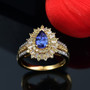 tanzanite yellow sapphire and diamond ring in 18k yellow gold over sterling silver shown in a lifestyle photo