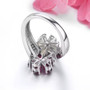 back view of rhodolite garnet opal and zircon flower bypass ring in rhodium over sterling silver