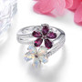 front view of rhodolite garnet opal and zircon flower bypass ring in rhodium over sterling silver