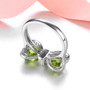 back view of peridot and white zircon bow ring in rhodium over sterling silver