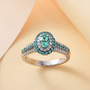 paraiba tourmaline and diamond halo ring in 950 platinum shown in a lifestyle photo