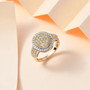 natural yellow and white diamond oval cluster halo ring in solid 10k yellow gold shown in a lifestyle photo
