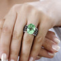 green quartz triplet and black spinel solitaire ring in rhodium over sterling silver worn on a hand