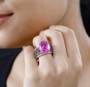 pink quartz triplet and black spinel solitaire ring in rhodium over sterling silver worn on a hand