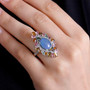 boulder opal triplet multi color tourmaline and zircon statement ring in rhodium over sterling silver worn on a hand