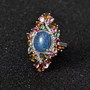 close up of boulder opal triplet multi color tourmaline and zircon statement ring in rhodium over sterling silver