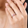 mahenge pink spinel and moissanite dainty solitaire ring in 18k rose gold over sterling silver worn on a hand