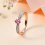 side view of mahenge pink spinel and moissanite dainty solitaire ring in 18k rose gold over sterling silver