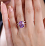 amethyst and white zircon solitaire ring in 18k rose gold over sterling silver worn on a hand