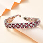 rhodolite garnet and rainbow moonstone tennis bracelet in rhodium over sterling silver shown in a lifestyle photo