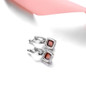 sugar-loaf cut hessonite garnet dangle earrings in rhodium over sterling silver